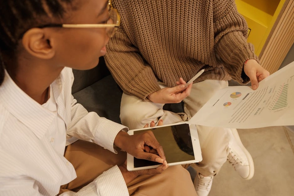 A professional business consultant presenting a strategy on a digital tablet.